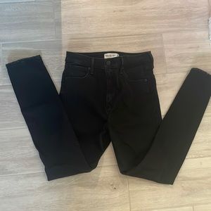 black jeans with rips on the knees